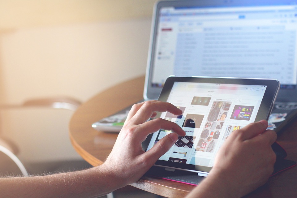 using a tablet and laptop